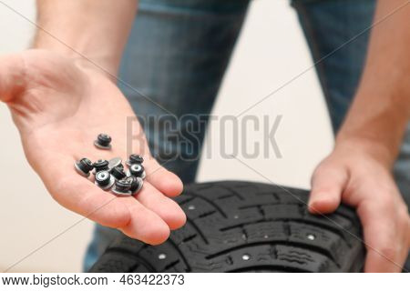 Renew Lost Studs. Hand With Repair Steal Studs. Worn Tire Tread, Winter Studded Tire - Wheel Repair 