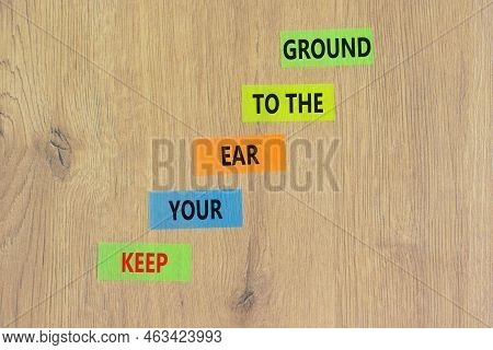 Keep Your Ear To The Ground Symbol. Concept Words Keep Your Ear On The Ground On Colored Paper. Beau