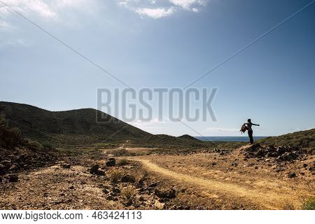 Happy Hiker Young Woman With Trekking Backpack Standing On Stone  In Summer Mountains - Enjoying The