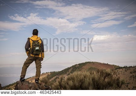 Lonely Man In Trekking Adventure Discover Activity At The Mountain With Backpack - Hiker Looking The