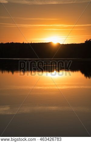 Sunset With Reflection On A Swedish Lake In Smalland. Romantic Evening Mood. Landscape Shot From Sca