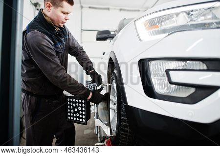Auto Mechanic Sets American Suv Car For Diagnostics And Configuration Camber Check In Workshop Of Se