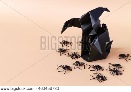 A Black Ghost With Spiders On A Light Background Is The Theme Of Fear.