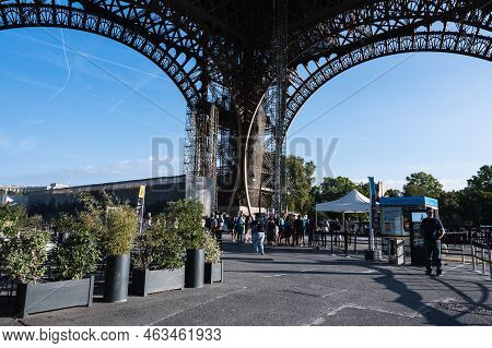 Paris, France - August 27 2022: People Queueing To Go Up The Eiffel Tower. Iron Structure Building, 