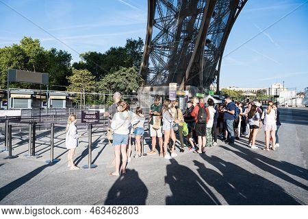 Paris, France - August 27 2022: People Queueing To Go Up The Eiffel Tower. Iron Structure Building, 