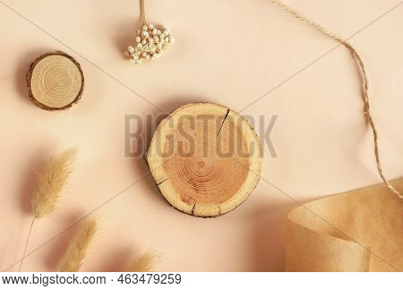 Empty Woodcut On Trendy Pastel Beige Background With Pampas Grass And Dry Flower. Wooden Platform Fo