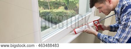 Caulking Silicone Sealant To Repair Window In House