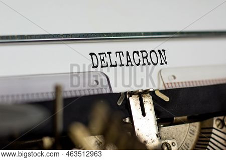 Covid-19 Corona Deltacron Symbol. The Concept Word Deltacron Typed On Retro Typewriter. Beautiful Wh