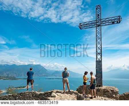 Manerba Del Garda, Lake Garda, Italy. July 27 2022. Visitors And Photograpers At Summit Cross At The