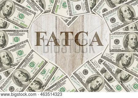 Complying With The Us Foreign Account Tax Compliance Act, One Hundred Dollar Bill In The Shape Of A 