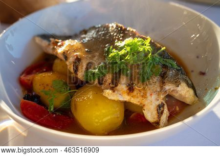 Provence Cuisine, Filet Of Seabass White Fish Served With Potatoes, Tomatoes And .bouillabaisse Jus