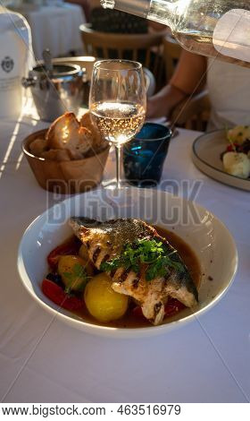Provence Cuisine, Filet Of Seabass White Fish Served With Potatoes, Tomatoes And .bouillabaisse Jus