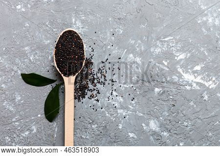 Quinoa Seeds In Spoon On Colored Background. Healthy Kinwa In Small Spoon. Healthy Superfood.