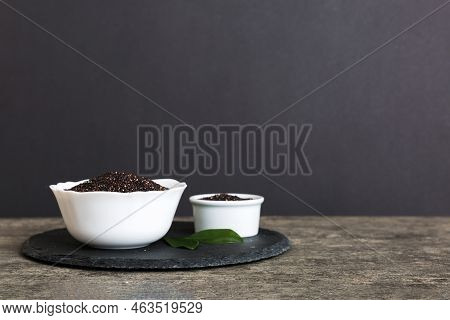 Quinoa Seeds In Bowl On Colored Background. Healthy Kinwa In Small Bowl. Healthy Superfood.