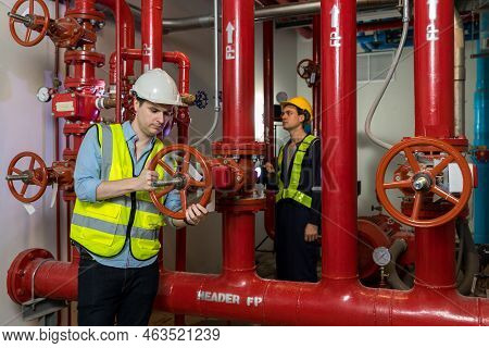 Engineer Or Technician Work Checking Fire Suppression System And Fire Equipment. Engineer Check Red 