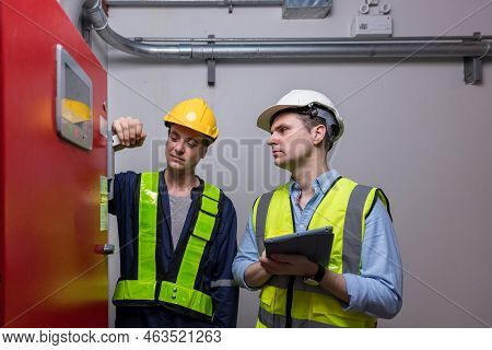 Engineer Or Technician Work Checking Fire Suppression System And Fire Equipment. Engineer Check Red 