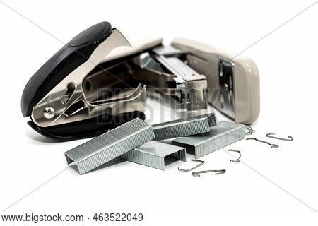 Stapler And Anti-stapler With Staples On A White Background. Office Supplies Isolate