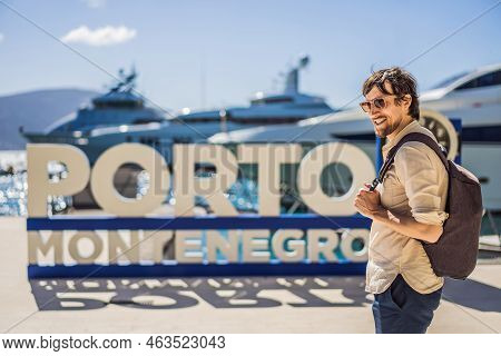 Porto Montenegro Translates As Port Of Montenegro. Man Tourist On Background Of Yacht Marina, Beauti