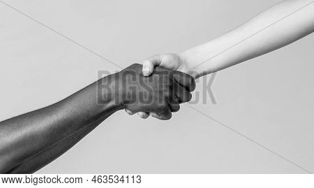 Woman And African Woman Hand. Helping Hand, Rescue, Multiathnic People. Helping Hands, Rescue Gestur