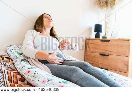 Pregnant Contractions Time. Pregnancy Woman Watching Clock, Holding Baby Belly. Childbirth Time, Con