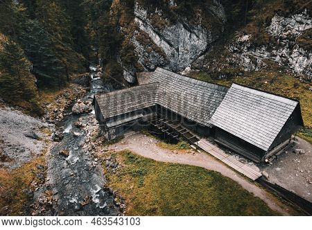 Photo Of A Beautiful Wooden Cabin With River In The Forest From Above - Mlyny Oblazy (slovakia) - Ta