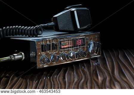 Sideband Cb Radio Set To Channel 13 On A Wavy Bronze Surface
