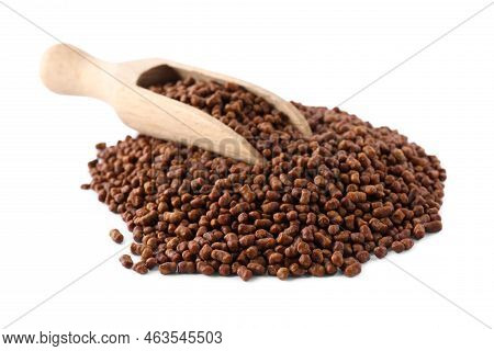Wooden Scoop With Buckwheat Tea Granules On White Background