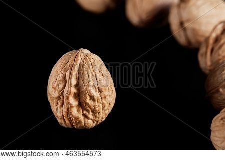 Walnut Photography On A Black Background Photographed Close-up