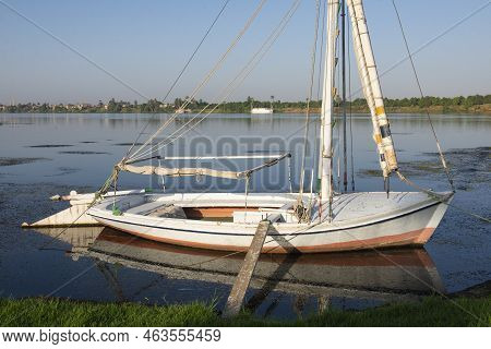 Traditional Egyptian Felluca River Sailing Boats Moored On The Nile Bank