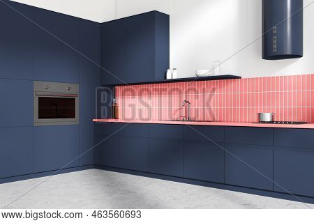 Corner View On Bright Kitchen Room Interior With Blue Cupboard, White And Pink Tile Wall, Concrete F