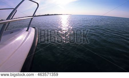 Seascape, View Of Sea Waves With Sun Reflection From Prow Of Motorboat. Boat Jumping On Waves On Sun