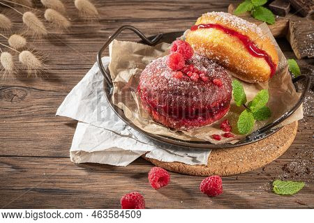 Bolas De Berlim, Or Berlin Balls. Portuguese Fried Dough With Sugar, Filled With Chocolate Or Raspbe