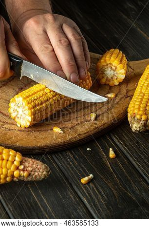 The Chef Cuts The Maize With A Knife. Corn Is An Excellent Dietary Breakfast Or Lunch. Working Envir