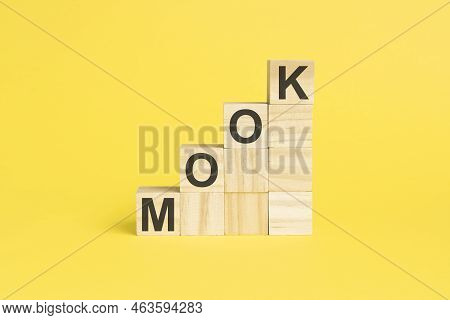 Word Mooc On Wooden Cubes, Yellow Background. Mooc - Short For Massive Open Online Course. Selective
