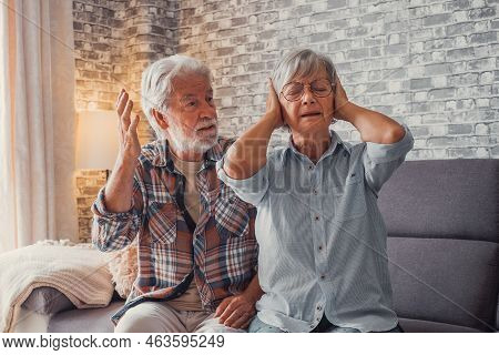 Man Shouting And Talking To Woman Tired Thinking On Separation Covering Her Ears.