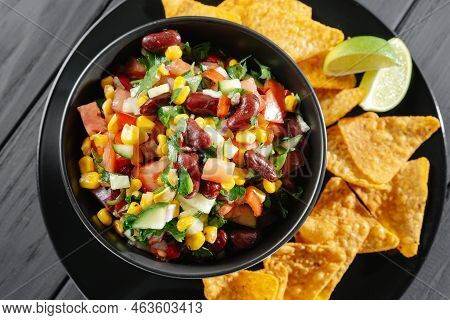 Homemade Organic Cowboy Caviar Dip With Corn Beans And Chips. Reducetarian, Flexitarian, Pescatarian