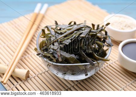 Fresh Laminaria (kelp) Seaweed Served On Light Blue Wooden Table, Closeup