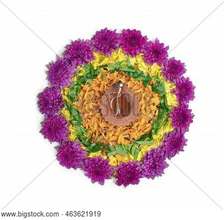 Flower Rangoli For Diwali Festival Made Using Marigold Or Zendu Flowers And Clay Oil Lamp