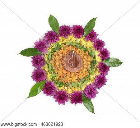 Flower Rangoli For Diwali Festival Made Using Marigold Or Zendu Flowers And Clay Oil Lamp