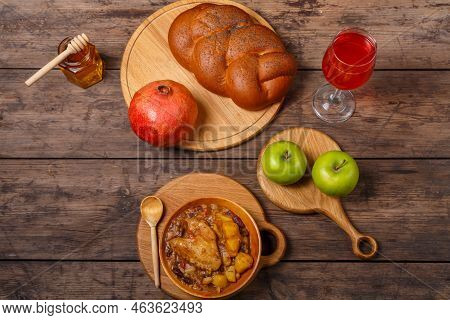 Ceremonial Table For Rosh Hashanah, Pomegranate, Wine, Honey, Apples, Challah And A Plate Of Hot Cho