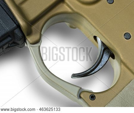 Ar-15 Trigger And Its Shadow On A White Background