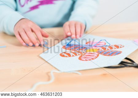 Little Girl Learning How To Sew With Sewing Craft Kit For Kids.