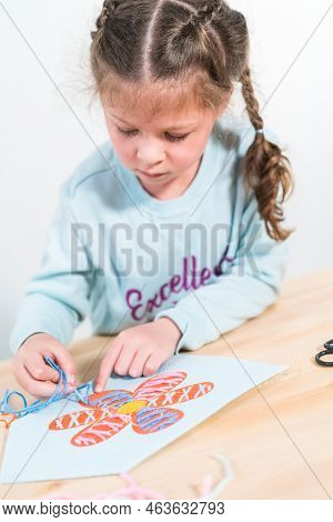 Little Girl Learning How To Sew With Sewing Craft Kit For Kids.