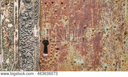 Old Rusty Keyhole In A Rusty Iron Door