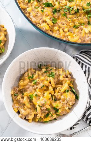 Serving Homemade Hamburger Helper In White Ceramic Bowls.