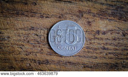 Five Lithuanian Cents Coin Isolated On Wooden Background.