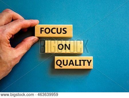 Focus On Quality Symbol. Concept Words Focus On Quality On Blocks On Beautiful Blue Table Blue Backg