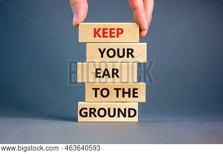 Keep Your Ear To The Ground Symbol. Concept Words Keep Your Ear On The Ground On Wooden Blocks. Busi