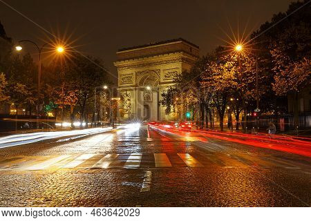 The Triumphal Arch In Rainy Evening, Paris, France.