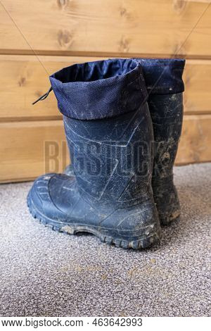 Dirty Blue Rubber Boots After Darden Work, Rustic Life And Work Concept